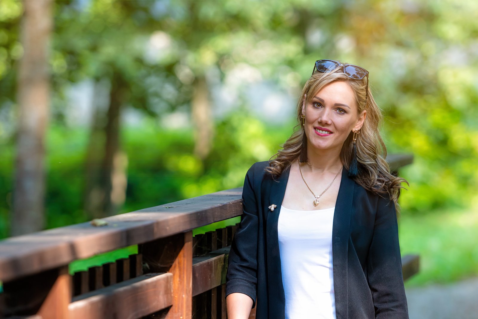 Woman standing outdoors, smiling